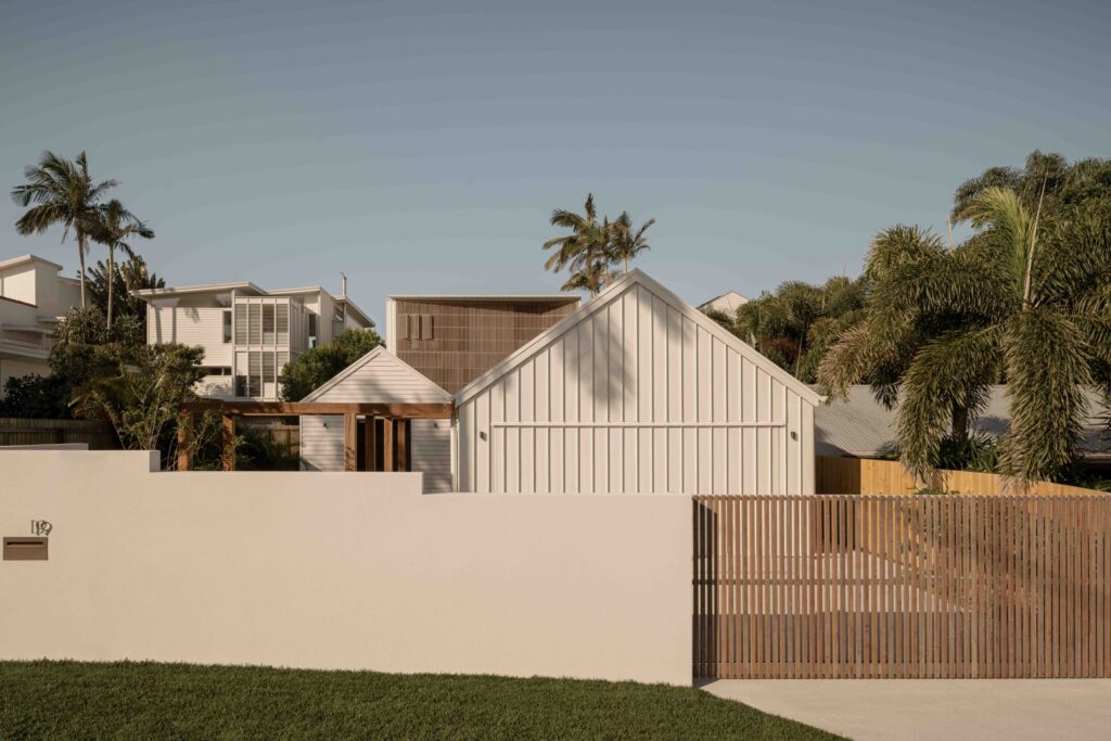 Panorama House street view with gabled forms, timber screening and coastal planting
